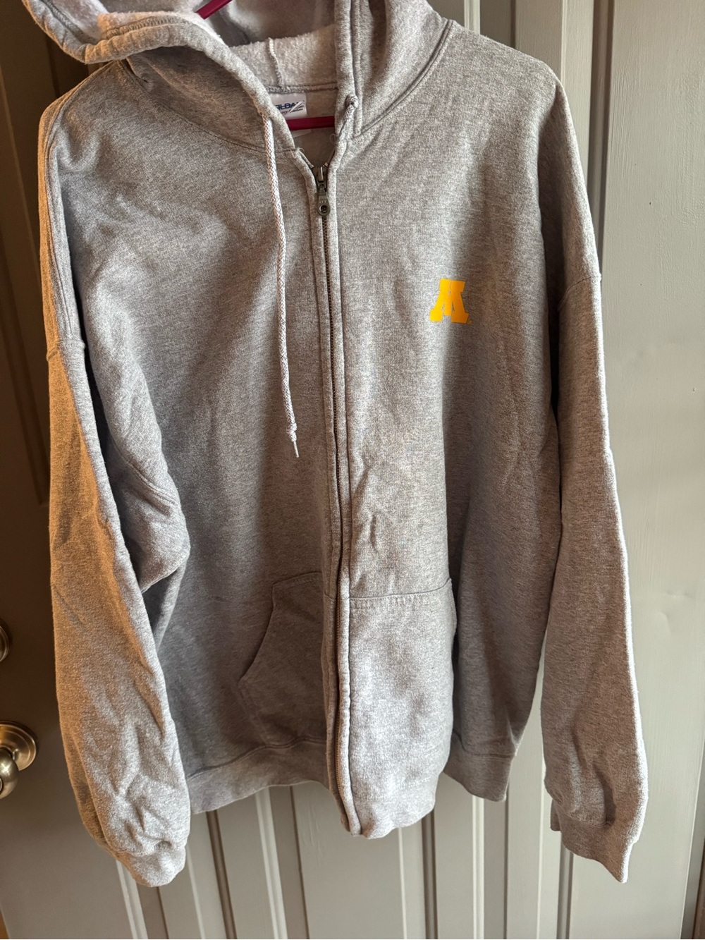 Gray Zip-Up Hoodie with Small Yellow M in the side